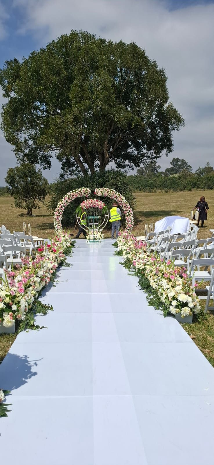 Wedding floral arch and decor setup